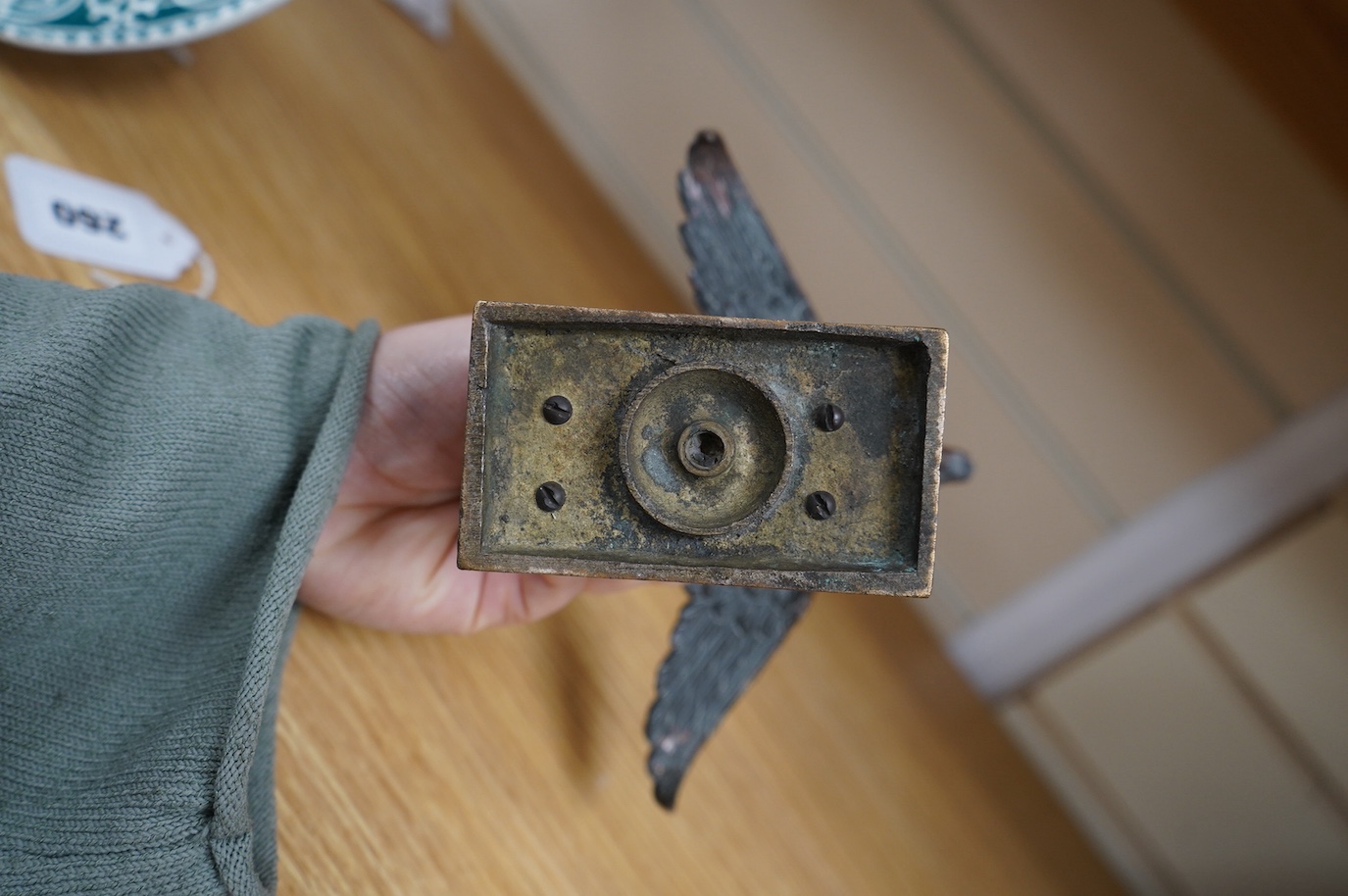 A bronze Royal Air Force 45th Squadron winged camel desk ornament, stamped Reg.746774 to the base
